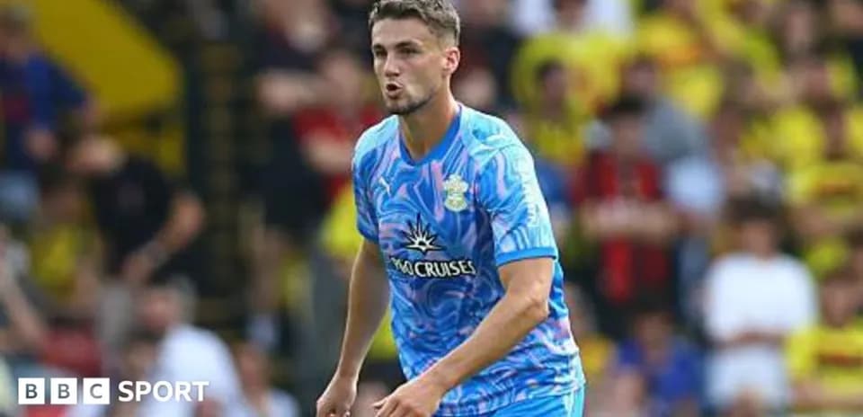 Player in blue kit during football match