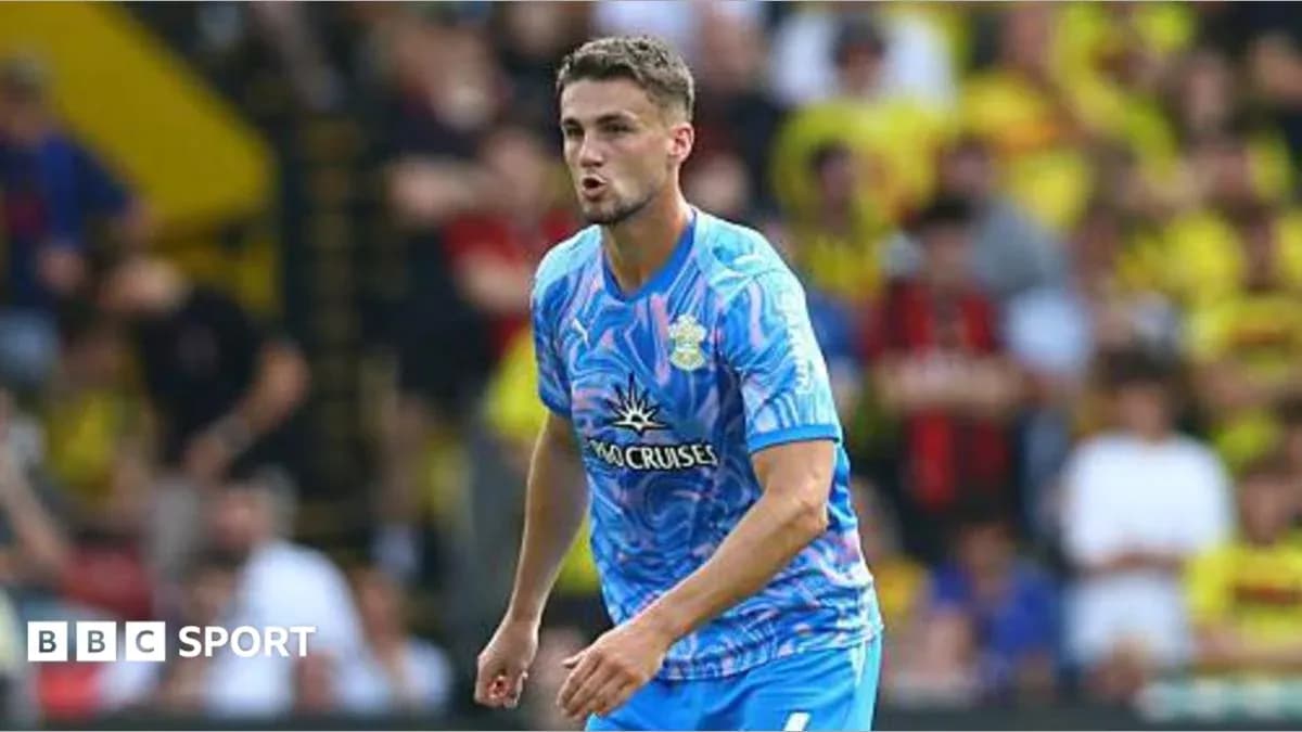 Player in blue kit during football match