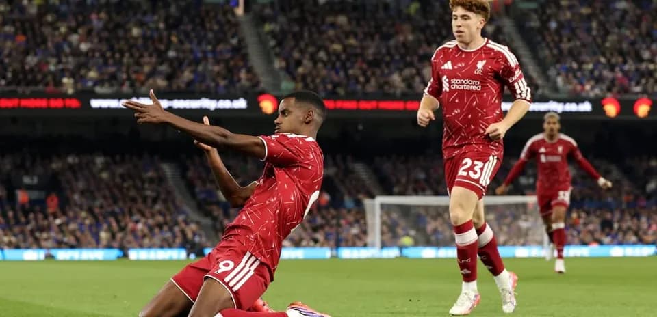 Liverpool players celebrating a goal on the pitch