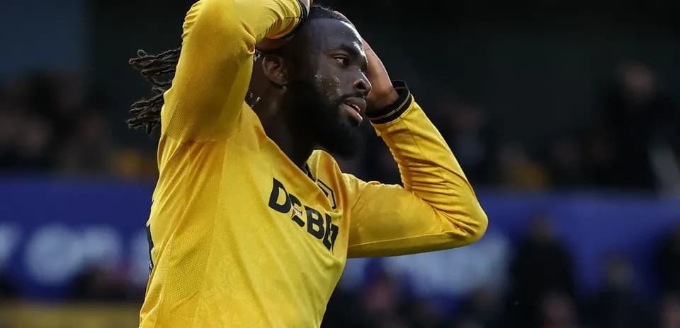 Player in yellow jersey reacting after missed opportunity