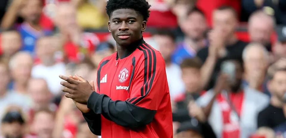 Player applauding fans during match warm-up