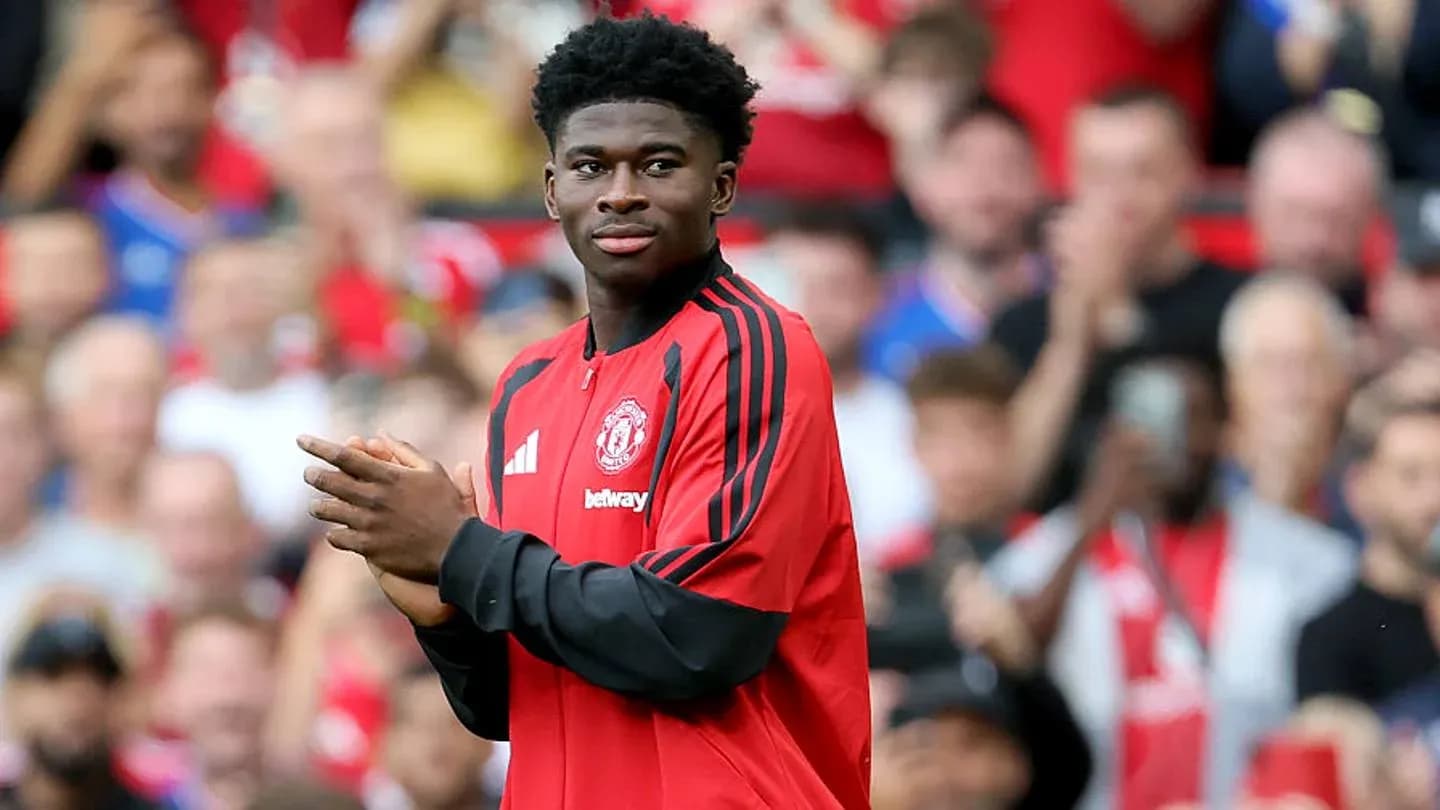 Player applauding fans during match warm-up