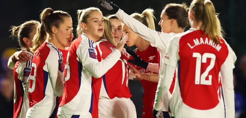 Arsenal W players celebrating during FA WSL match