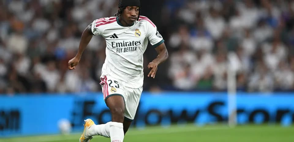 Player running with ball during match for Real Madrid