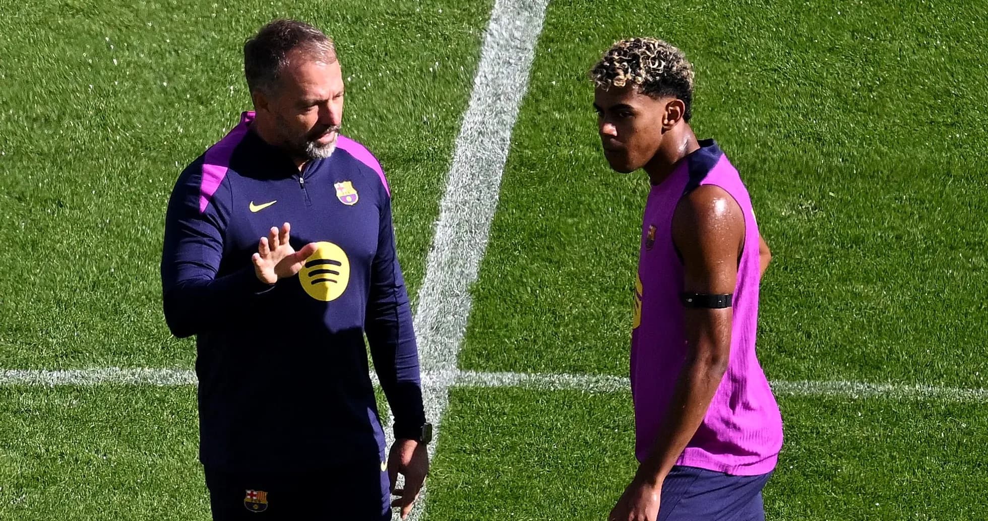 Coach discussing with player during training session