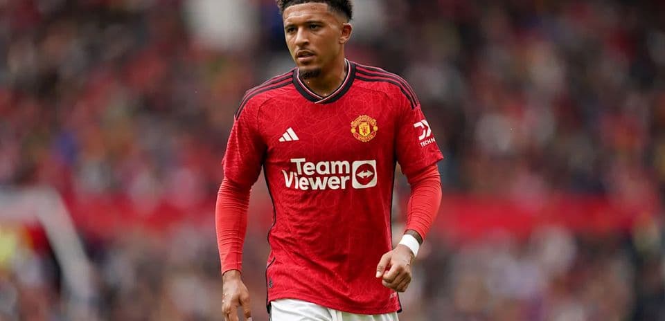 Player in red Manchester United jersey on field