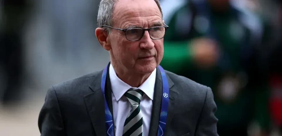 Man in suit with glasses at event entrance