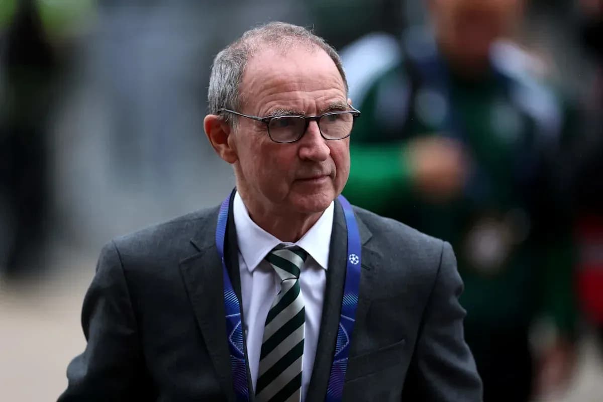 Man in suit with glasses at event entrance