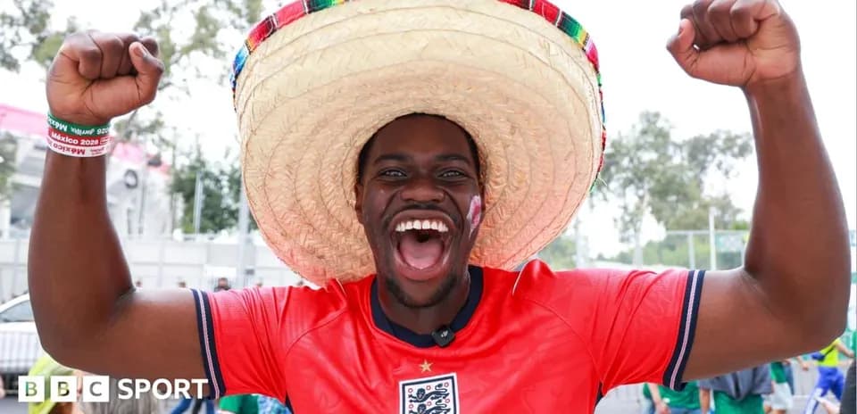 Fan wearing sombrero celebrating at a sports event