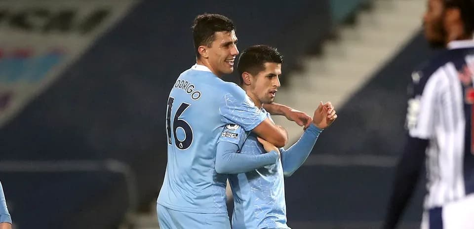 Players celebrating a goal during a match
