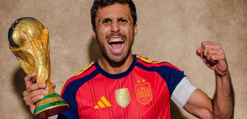 Player celebrating with World Cup trophy in hand