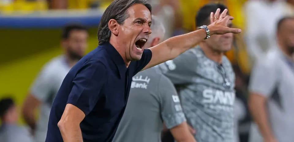 Coach gesturing and shouting during a match
