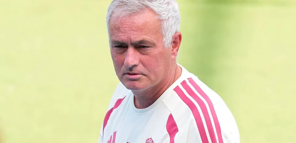 Coach observing training session on the field