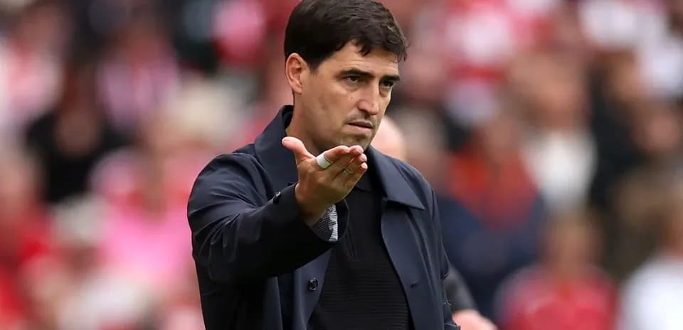 Coach gesturing during a match on the sidelines