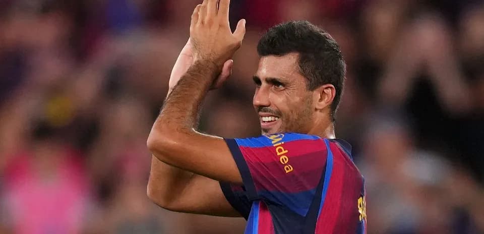 Player applauding fans during a match celebration