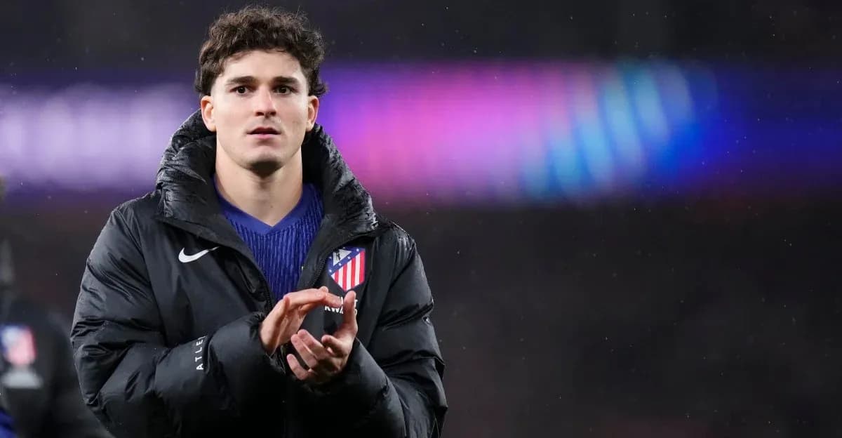 Player applauding while wearing Atlético Madrid jacket