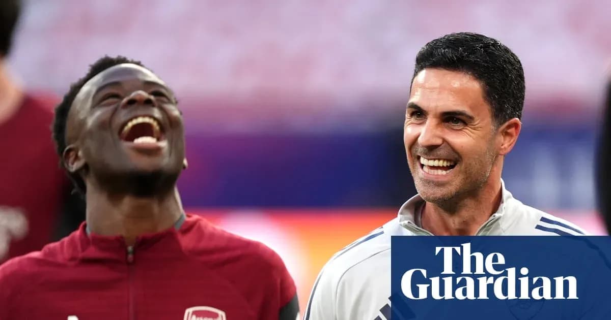 Player and coach laughing during warm-up session