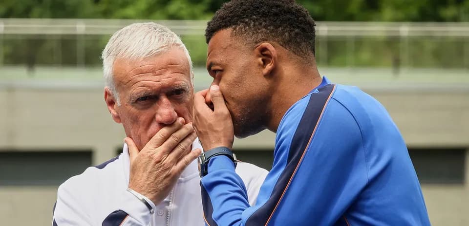 Coach and player discussing during training session
