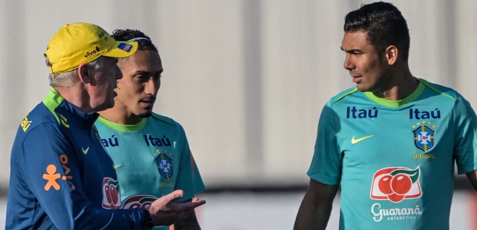 Coach discussing with players during training session