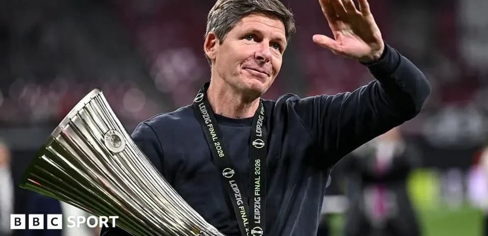 Coach celebrating with trophy after final match