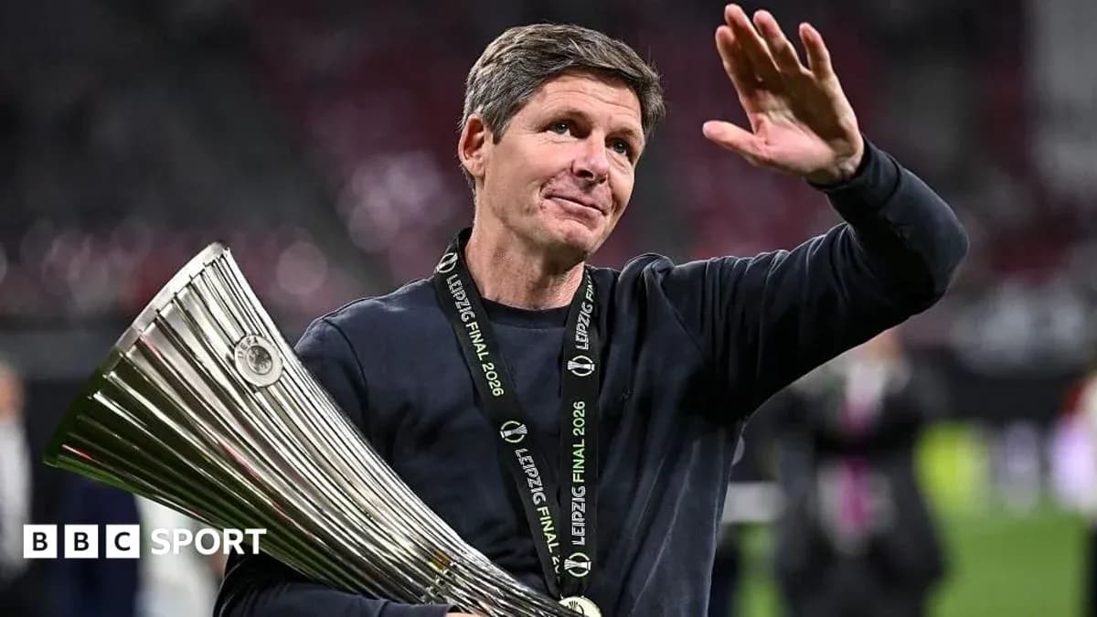 Coach celebrating with trophy after final match