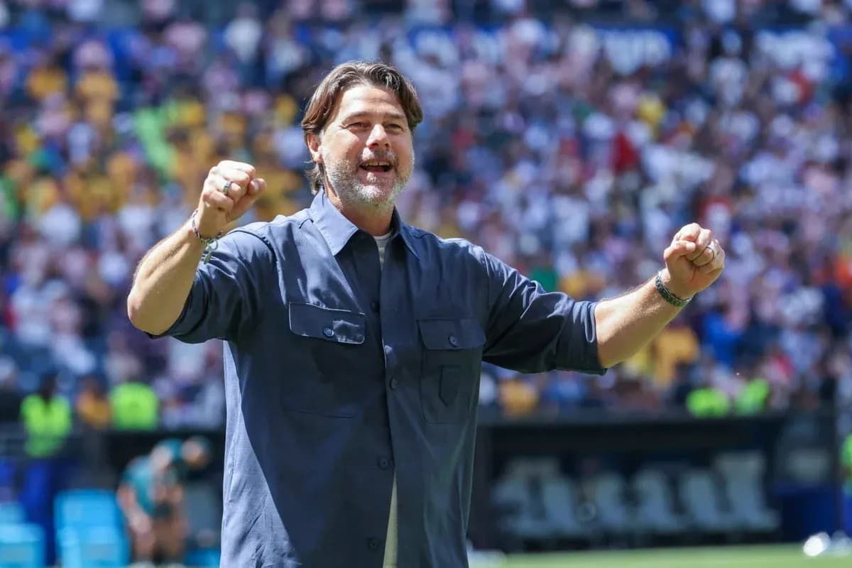 Coach celebrating during match at stadium