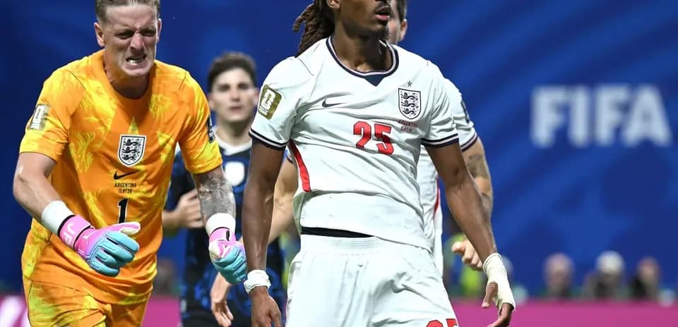 England players reacting during a tense moment in match