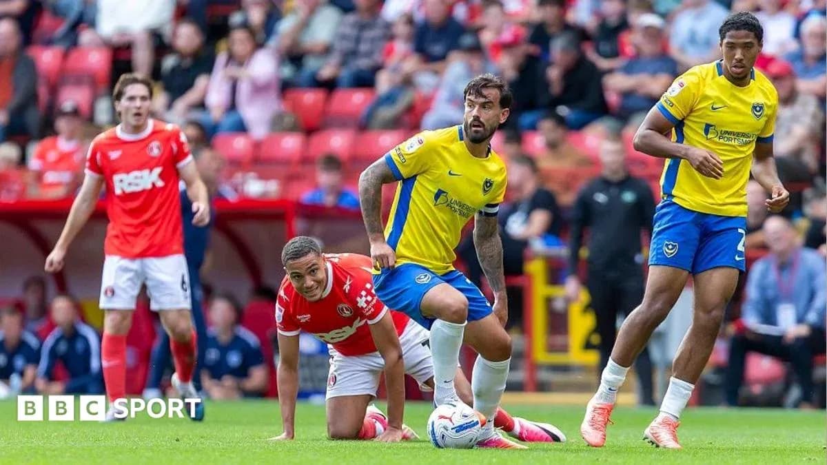 Players competing during a football match on the field