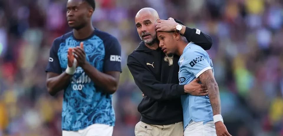 Coach comforting player after the match