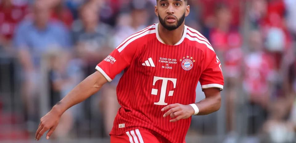 Player in red Bayern Munich kit running during match