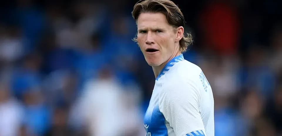 Player in blue kit during match action