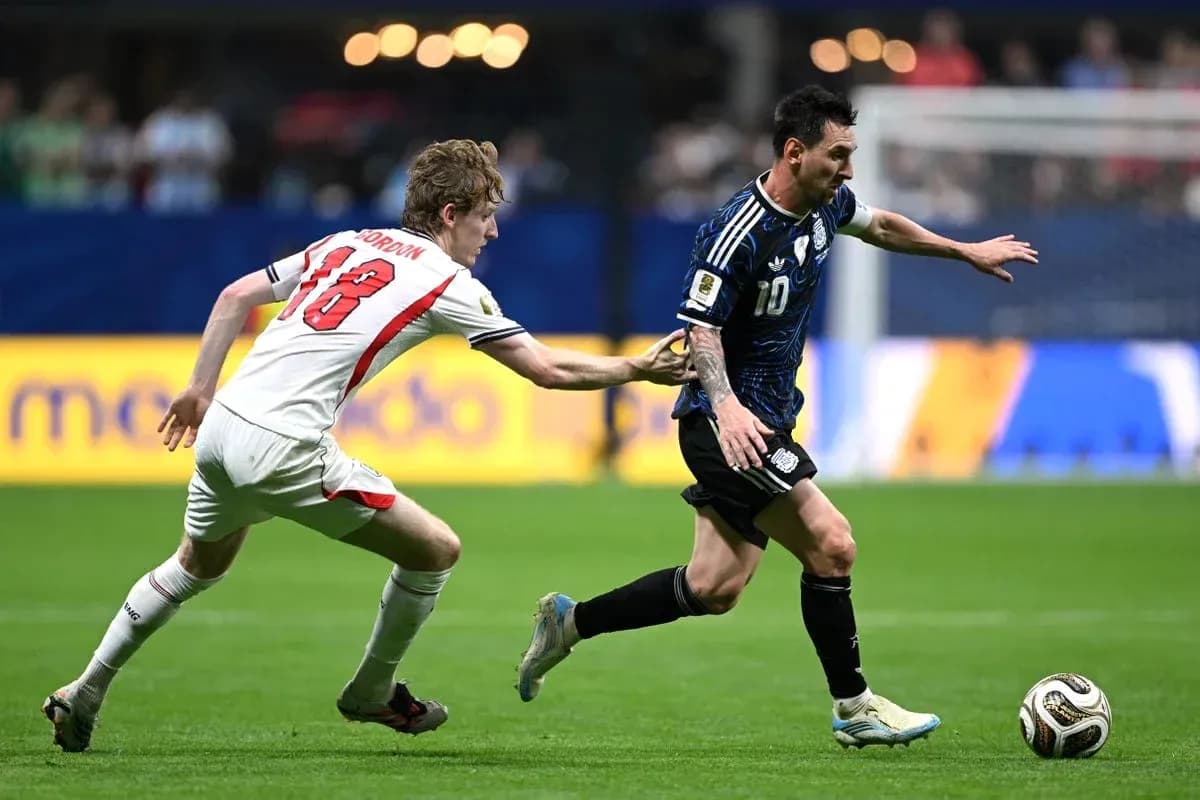 Player dribbling past opponent during soccer match