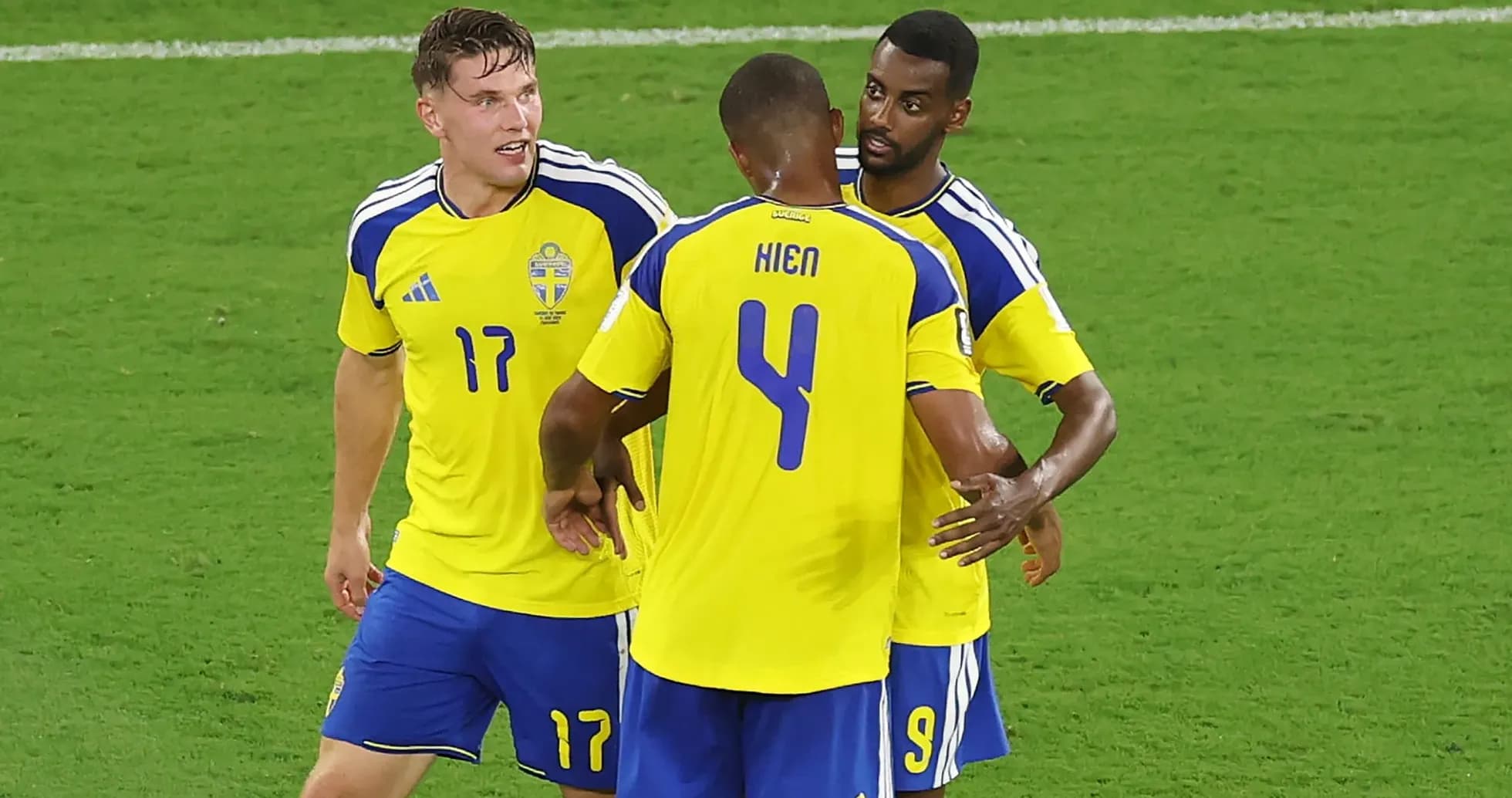 Sweden players celebrating on the field together
