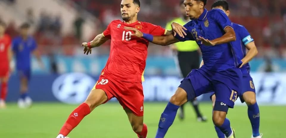 Two players battling for the ball during match