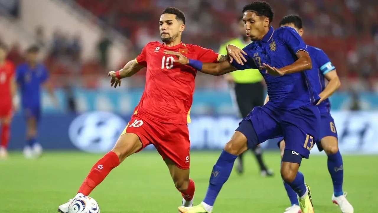 Two players battling for the ball during match