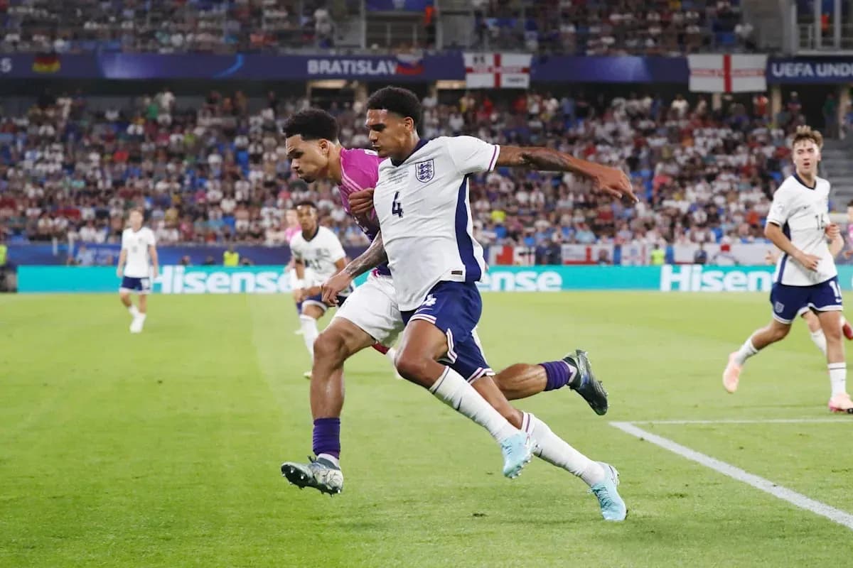 Two players competing for the ball in match