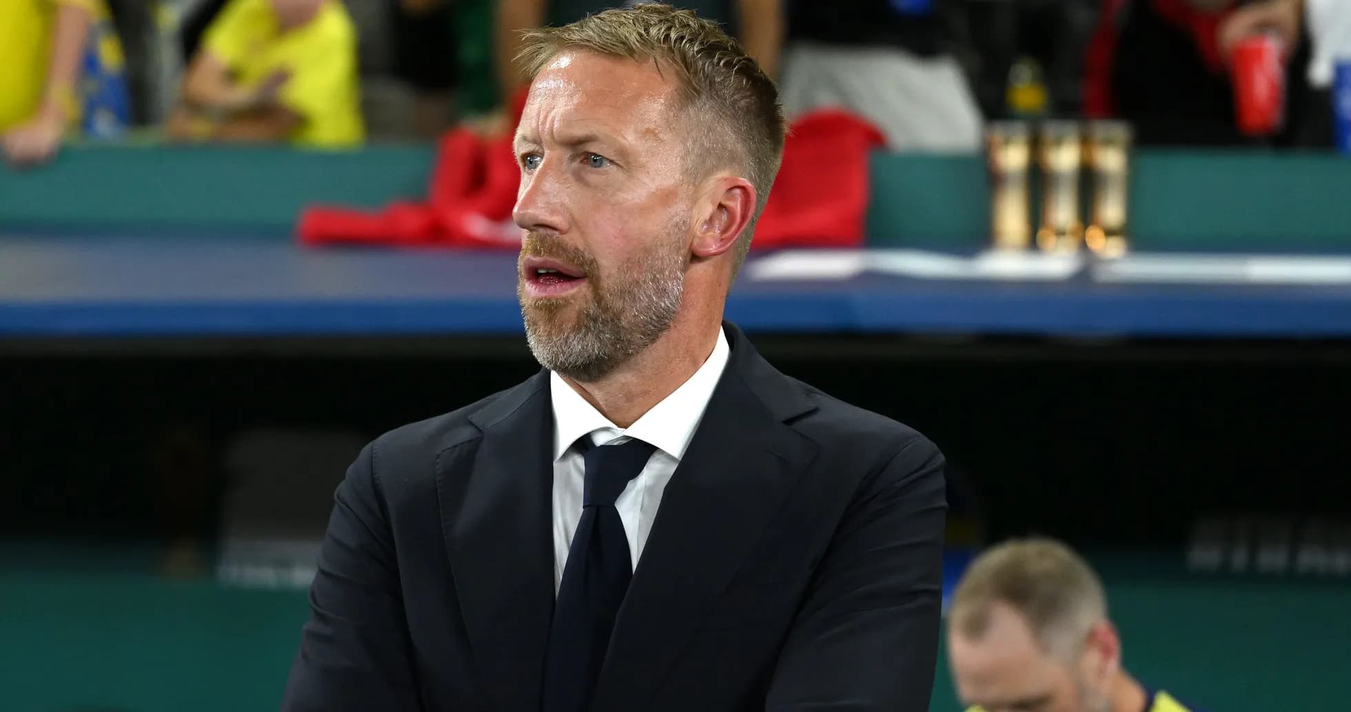 Coach observing the match from the sidelines