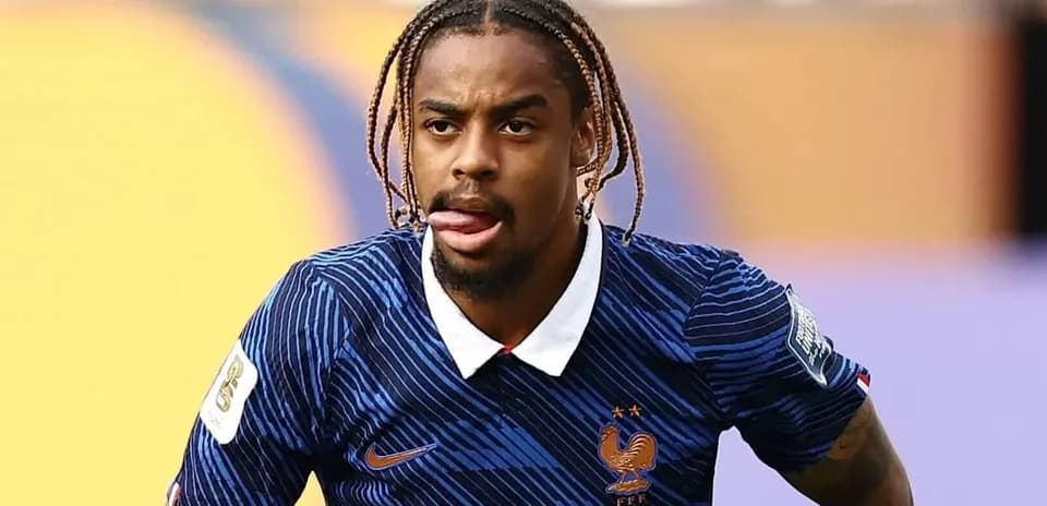 Player in France kit during match action
