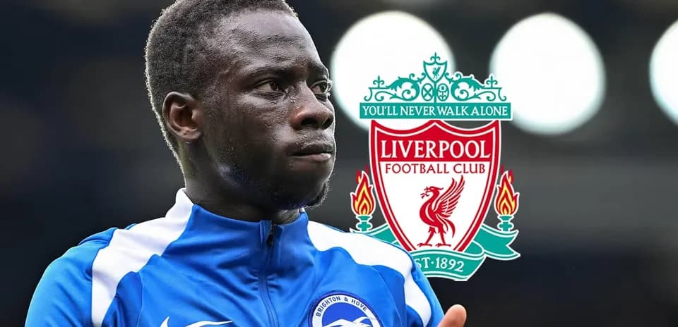 Player in Brighton kit with Liverpool logo background