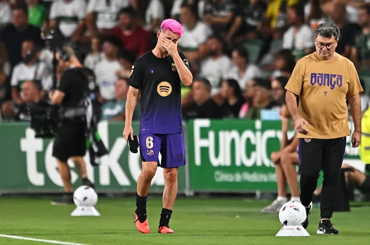 Player with pink hair walking off field during match