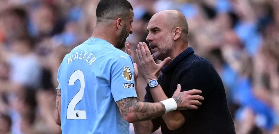 Kyle Walker and Pep Guardiola discussing during match