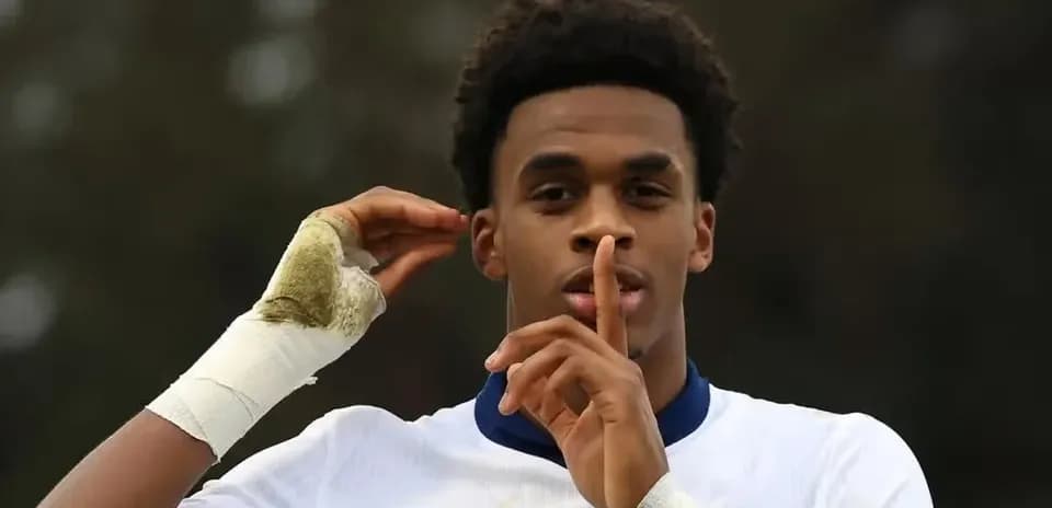 Player making shushing gesture during match celebration
