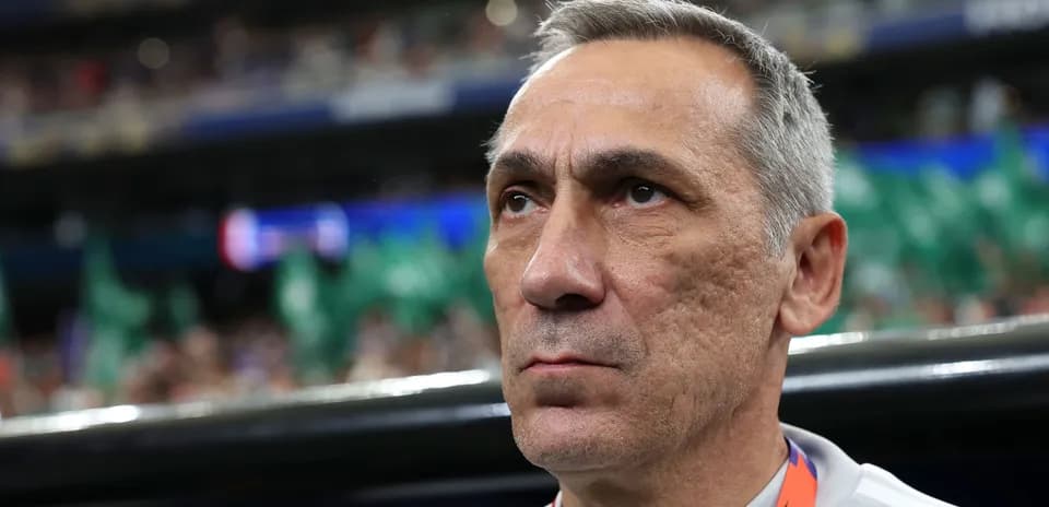 Coach focused during match in stadium environment