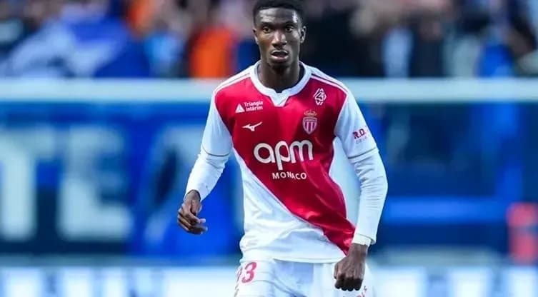 Monaco player wearing red and white jersey on field