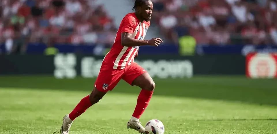 Player dribbling the ball on the field