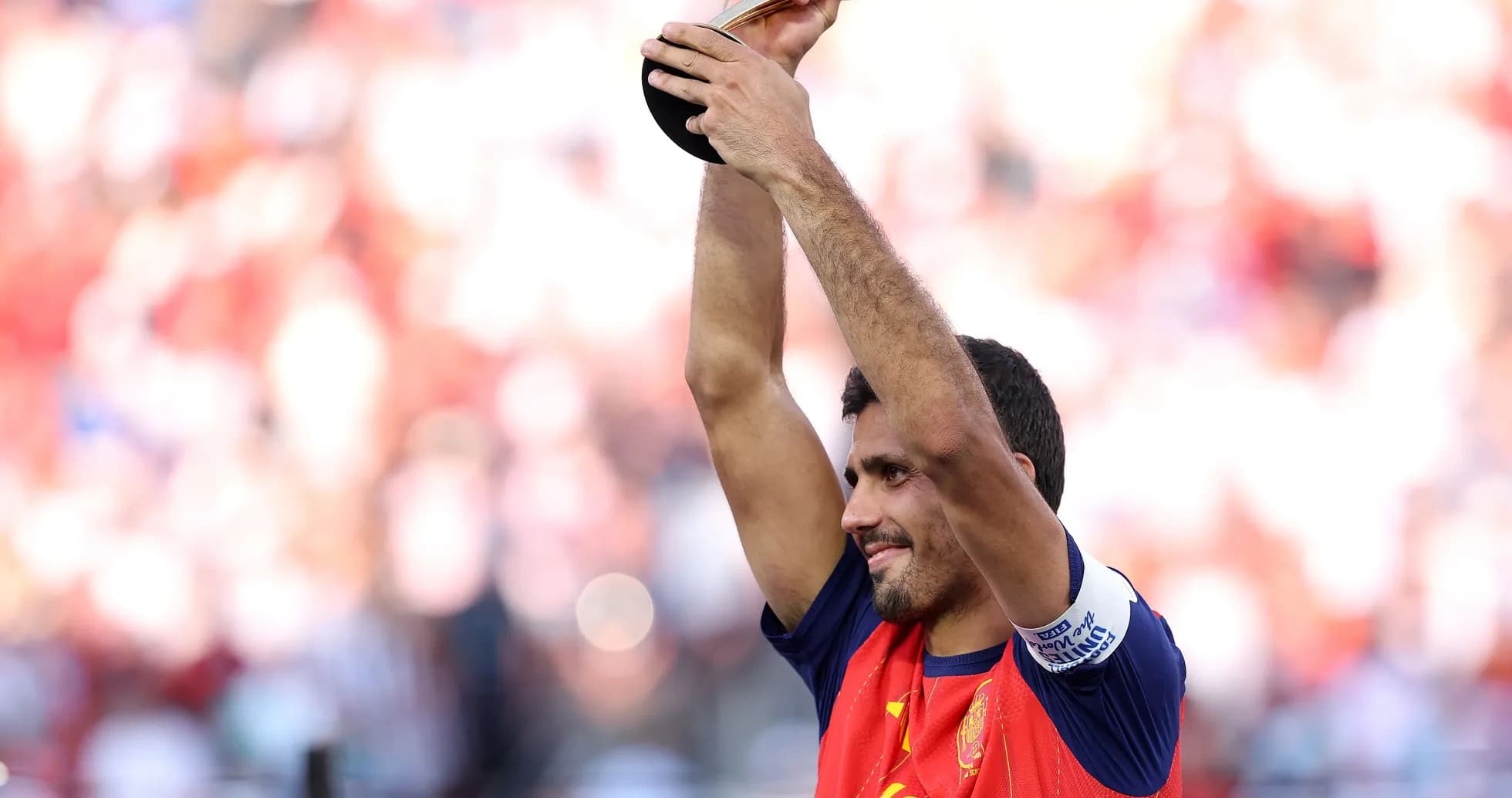 Player celebrating with trophy after winning match