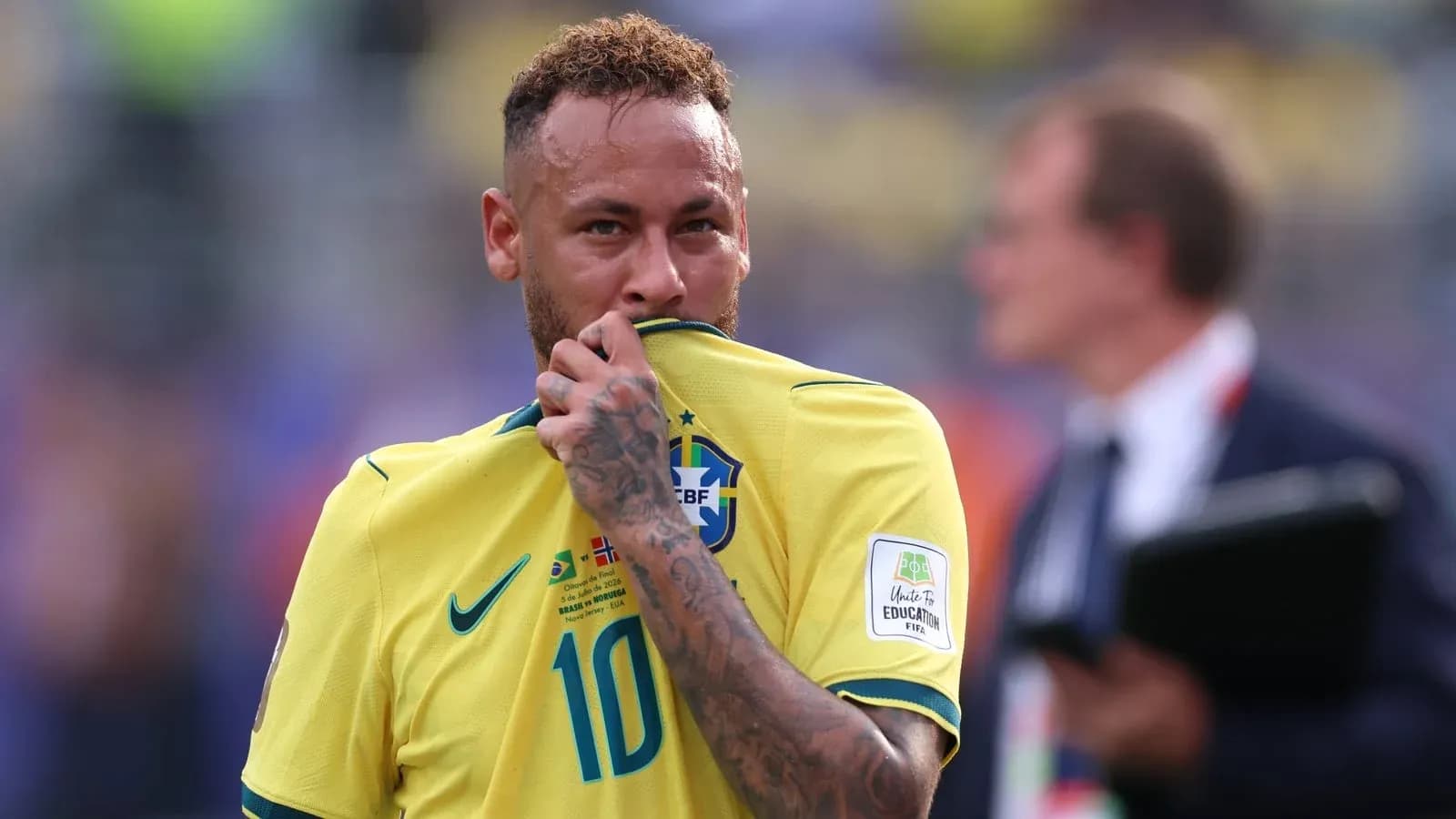 Neymar touching his jersey during a match