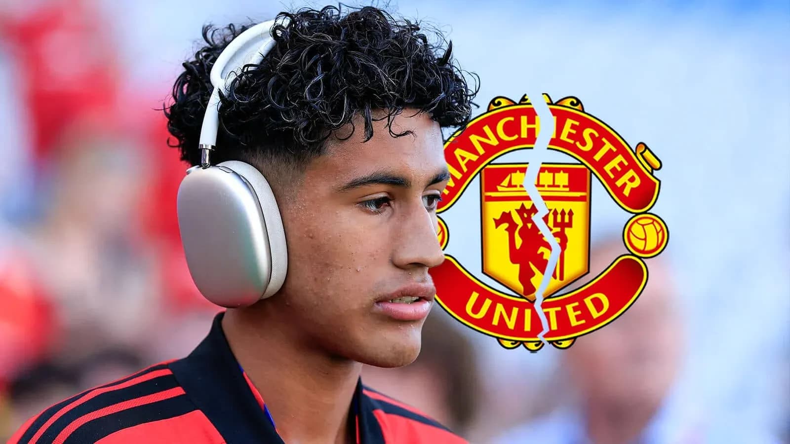 Player wearing headphones with Manchester United logo