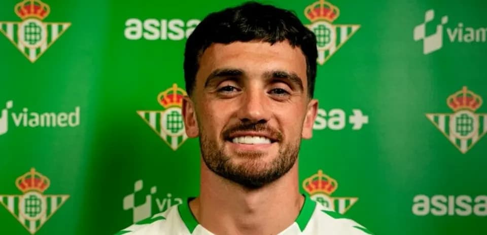 Football player posing for club announcement photo