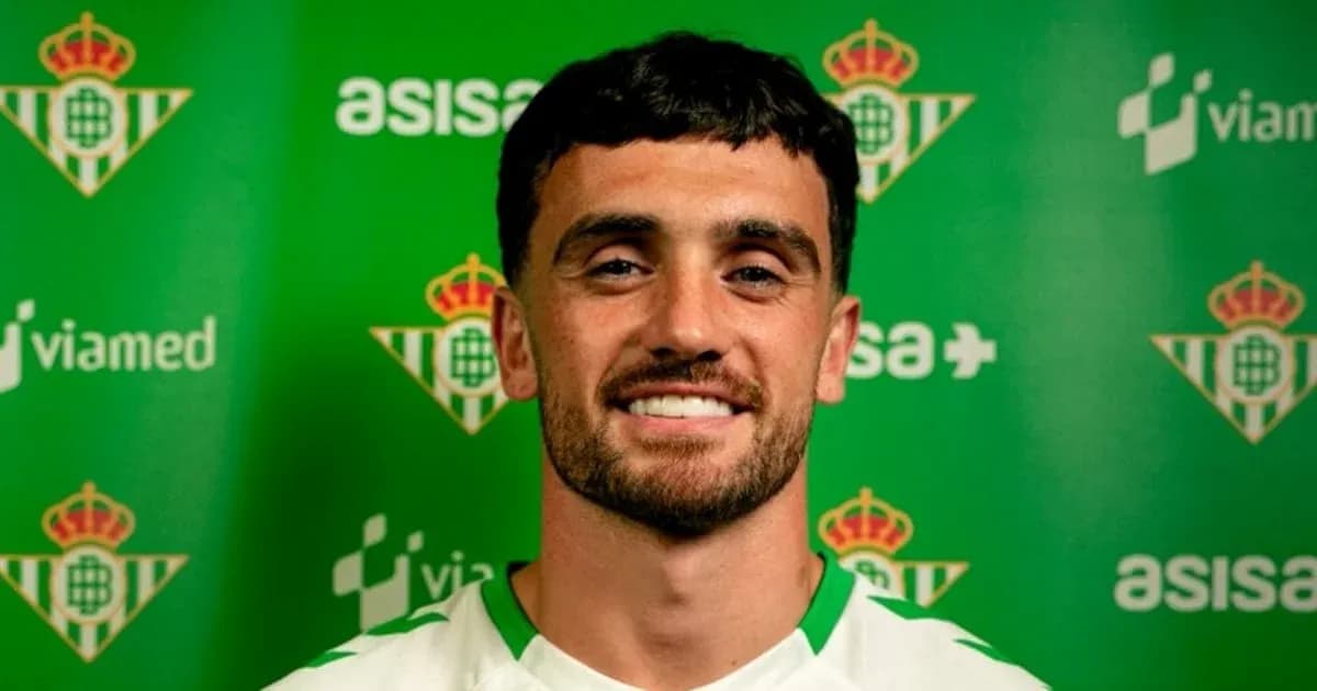 Football player posing for club announcement photo